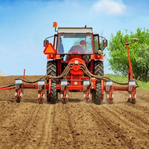 Tractor with mounted crop seeder